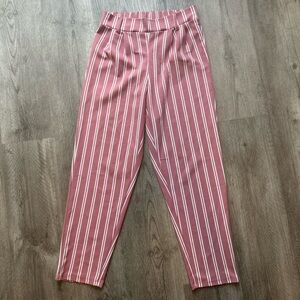 Woman’s pink and white stripped dress pants